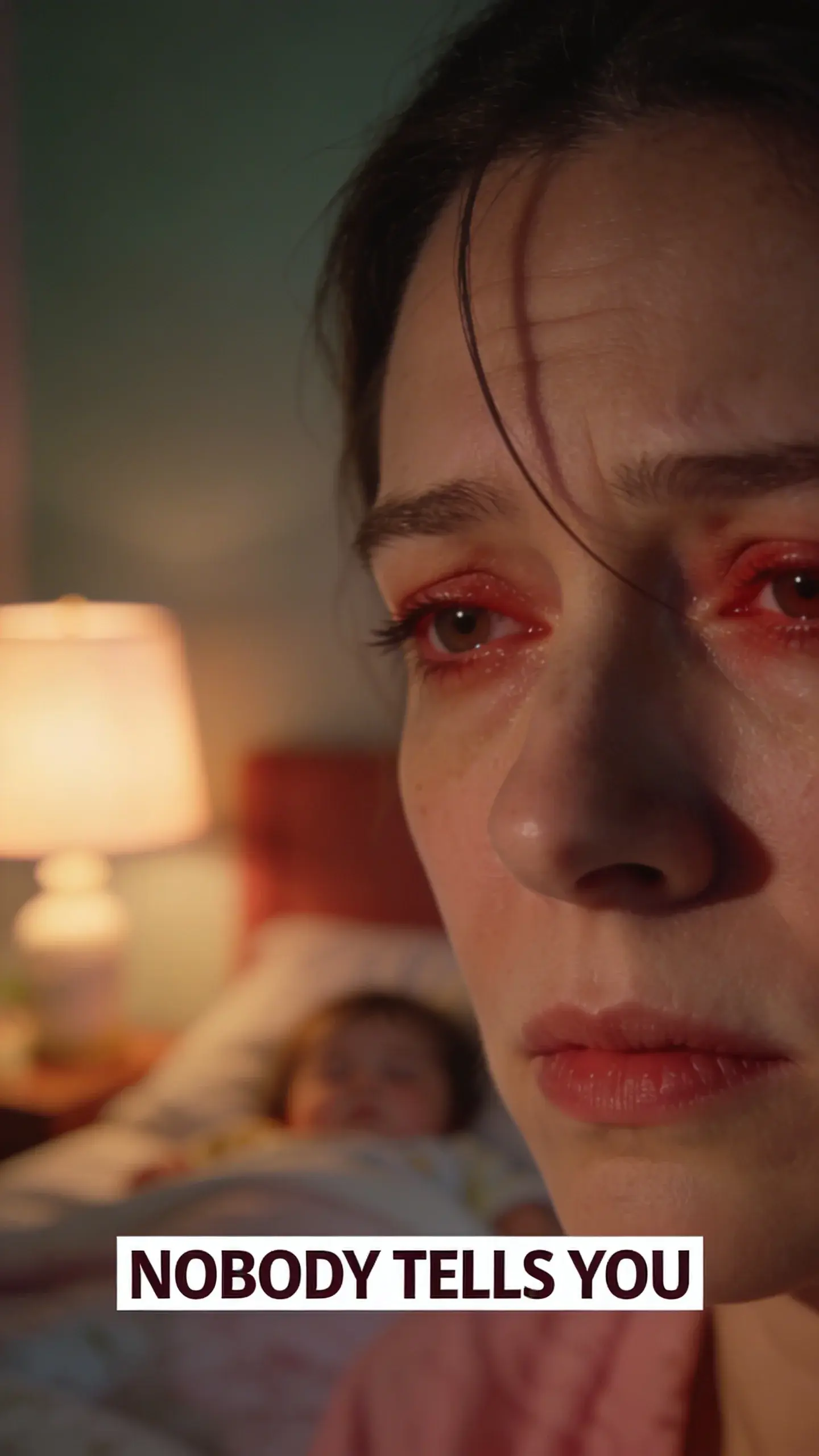 **CLOSE-UP FACE EMOTION**: vertical 9:16, ultra-tall composition optimized for mobile Pinterest feed, **SCENE**: An extreme close-up of a mother's face, her eyes slightly red-rimmed and heavy-lidded, a faint crease between her brows. Her gaze is distant, fixed on something just beyond the frame, conveying profound weariness and the intense, physical and mental exhaustion after a challenging day. A stray strand of hair falls across her forehead. The background is softly blurred, hinting at a dimly lit bedroom just after putting a child to bed. Her skin has a natural, unmade-up texture, emphasizing authenticity. **EMOTION HOOK**: Utterly drained by bedtime. **TOPIC PHRASE**: Mom exhaustion relief. **TEXT POSITION**: BOTTOM-CENTER, **OVERLAY**: text says exactly: "NOBODY TELLS YOU", bold sans-serif font, high contrast white text with dark outline or shadow so it is readable on mobile, **LIGHT**: Warm bedside lamp at night, casting soft, intimate light on her face, emphasizing the shadows under her eyes, **MOOD**: Exhausted, weary, depleted, overwhelmed, silent, **COLOR**: muted warm palette (dusty rose, cream, terracotta, soft sage, warm beige), gentle film grain, no logos, no watermarks, photorealistic, 8K, shallow depth of field, film aesthetic, cinematic color grade, no logos, no watermarks